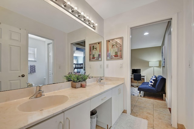 bathroom with double vanity and tile patterned floors