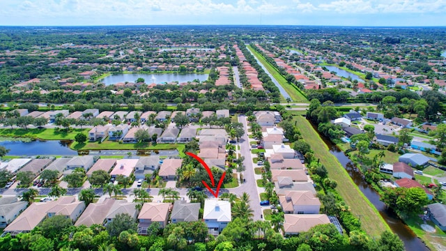 birds eye view of property featuring a residential view and a water view