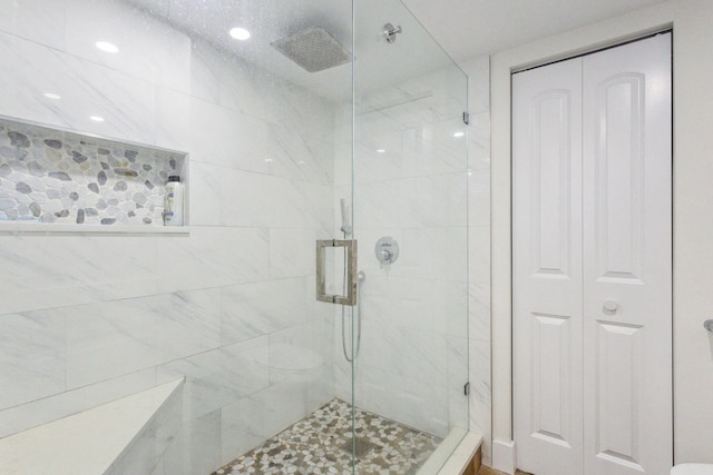 full bathroom with a stall shower, a closet, and recessed lighting