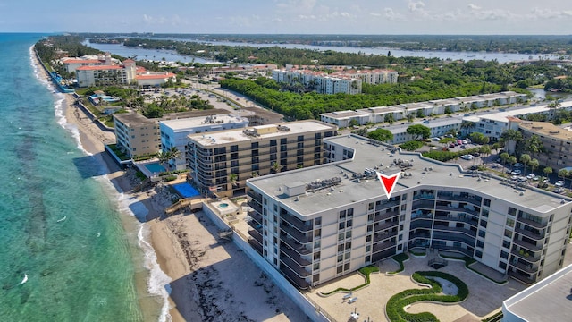 aerial view featuring a beach view and a water view