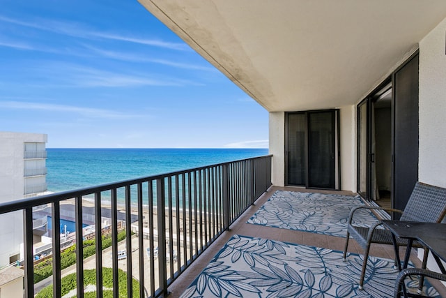 balcony featuring a water view