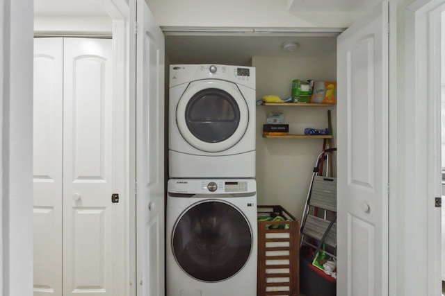 washroom featuring stacked washer and dryer