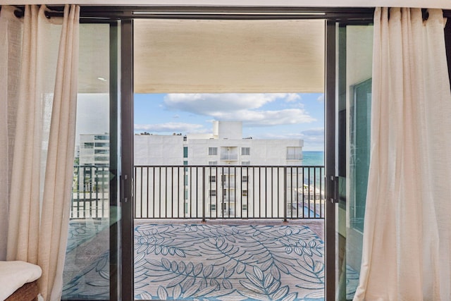 balcony featuring a water view