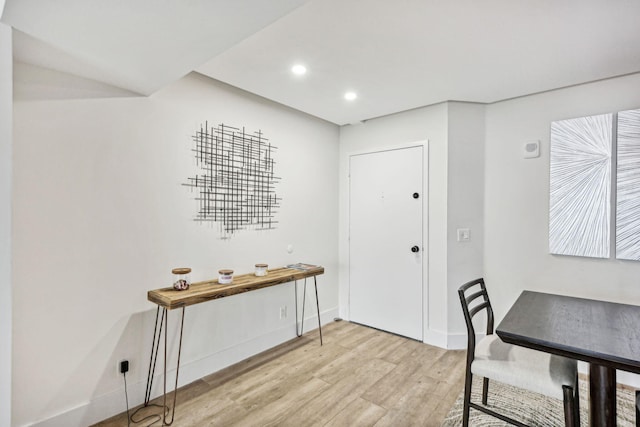 dining area with light wood-style flooring, baseboards, and recessed lighting