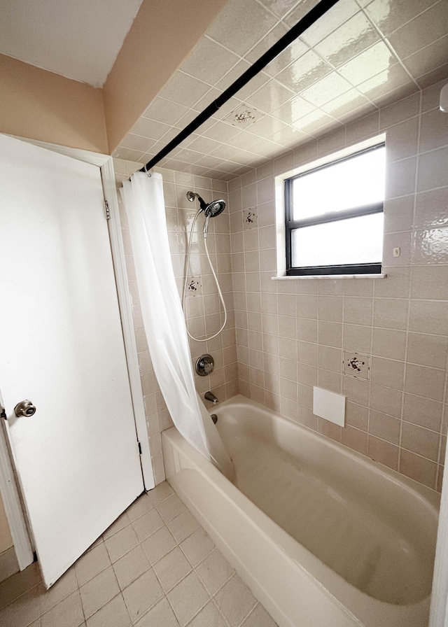 bathroom featuring tile patterned floors and shower / bath combination with curtain