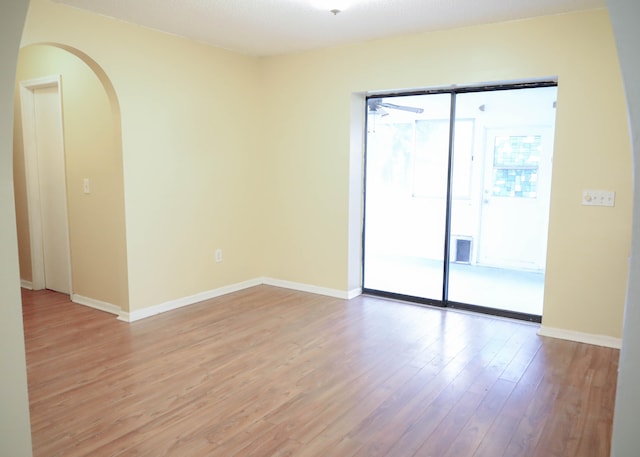 empty room with light hardwood / wood-style floors