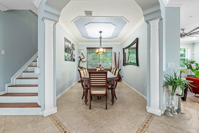 dining room featuring ornamental molding, ceiling fan, decorative columns, and light tile patterned flooring