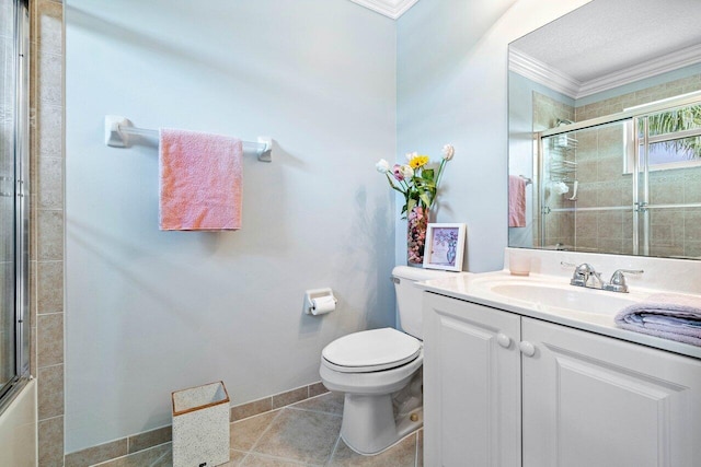 full bathroom with vanity, tile patterned floors, toilet, and crown molding