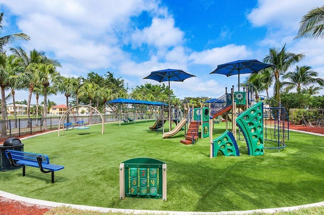 view of playground with a lawn