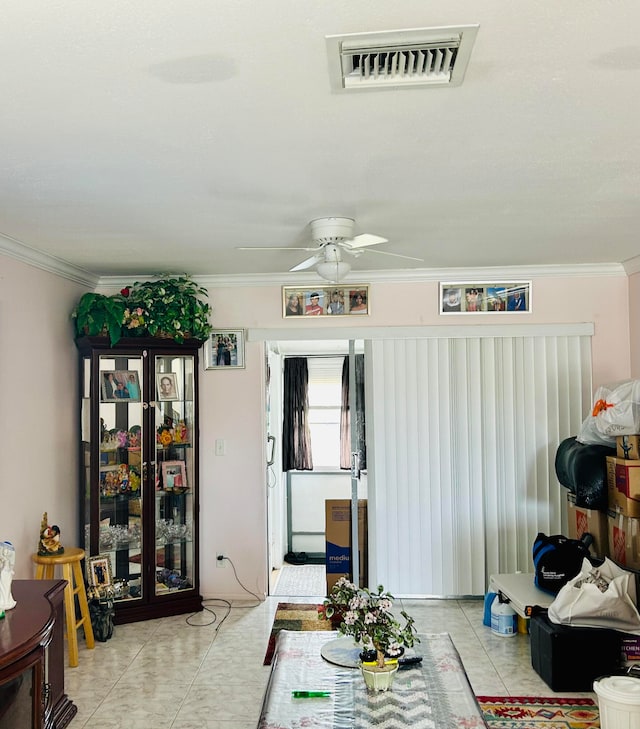 tiled living room with ceiling fan and ornamental molding