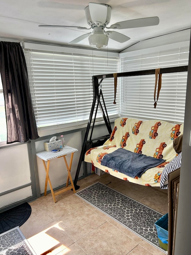 tiled bedroom with ceiling fan