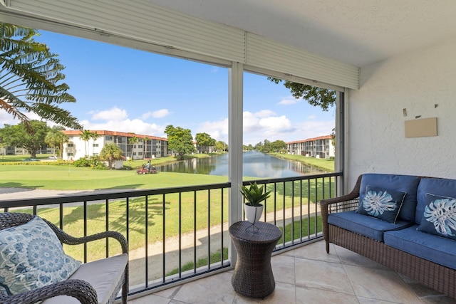 balcony featuring a water view