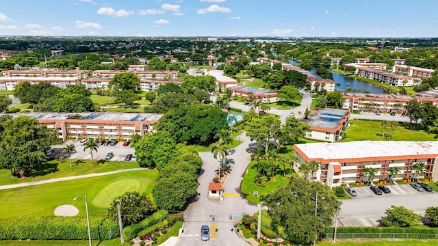 aerial view with a water view and golf course view