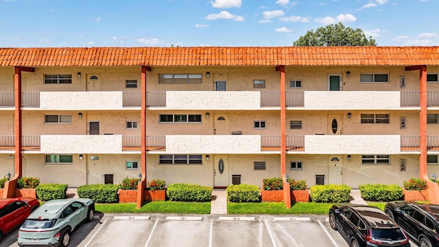 view of property with uncovered parking