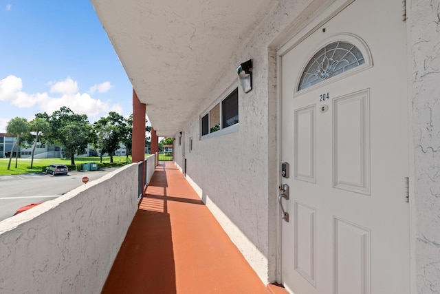 property entrance with stucco siding