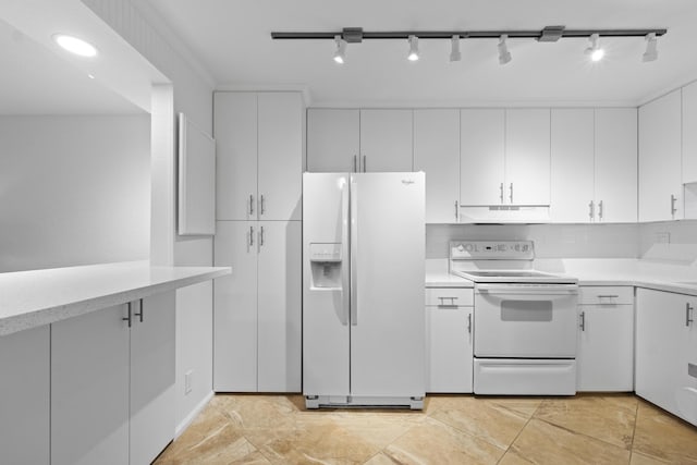 kitchen featuring white appliances, light countertops, under cabinet range hood, and white cabinets