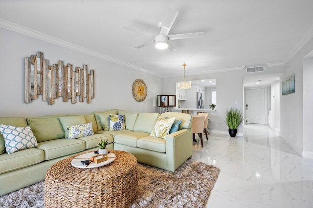 living room featuring ceiling fan with notable chandelier and ornamental molding