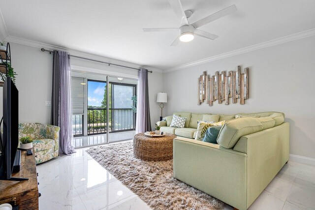 living room with ornamental molding and ceiling fan