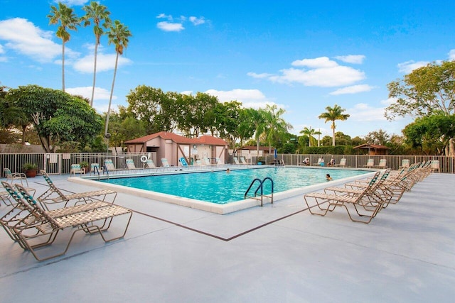 view of swimming pool with a patio