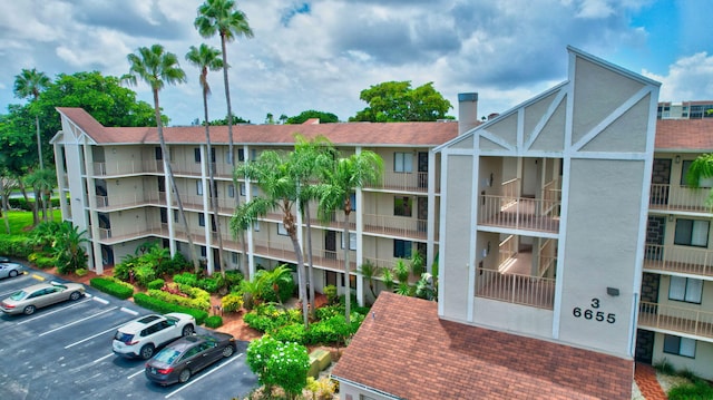 view of property featuring uncovered parking