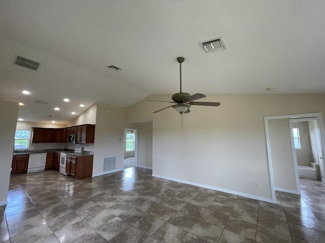 interior space with lofted ceiling, ceiling fan, white appliances, and sink