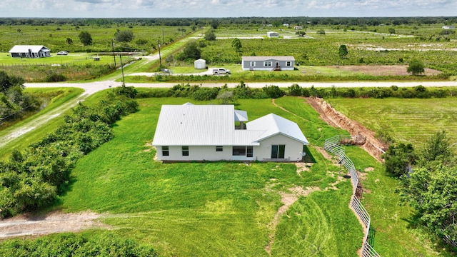 birds eye view of property with a rural view