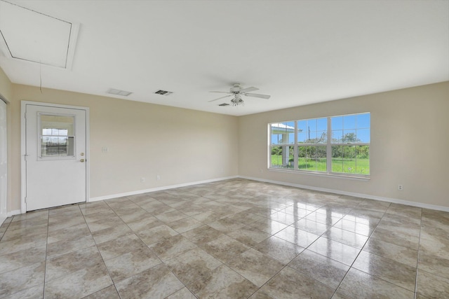 spare room featuring ceiling fan and light tile patterned floors