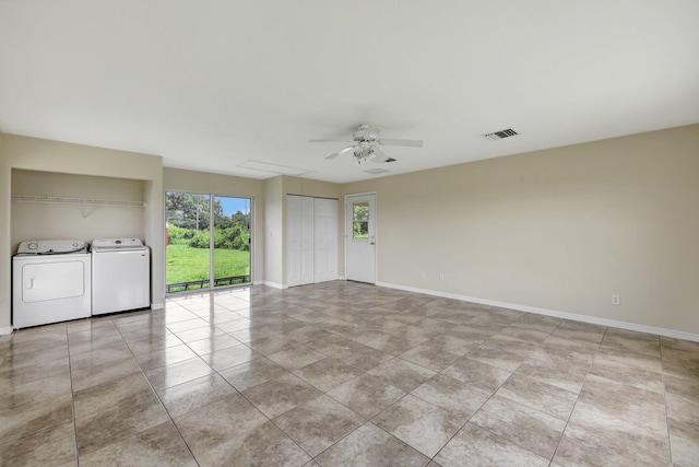 unfurnished room with ceiling fan and washing machine and clothes dryer