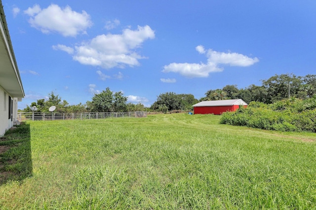 view of yard with a rural view