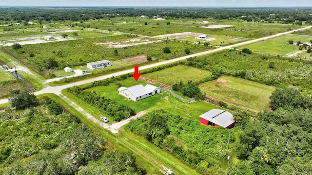 birds eye view of property featuring a rural view