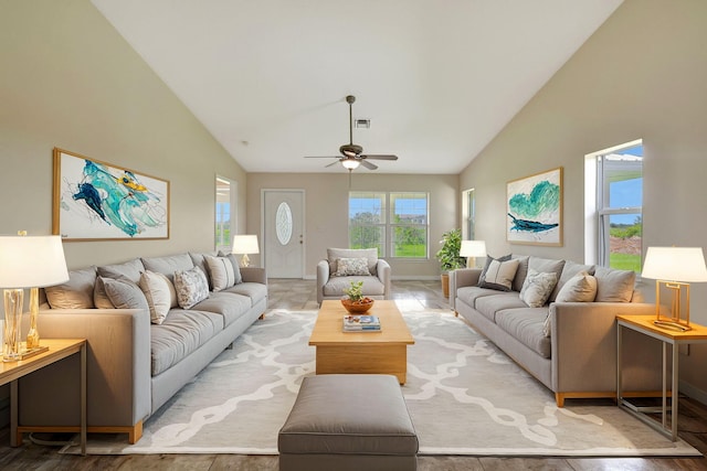 living room featuring high vaulted ceiling and ceiling fan