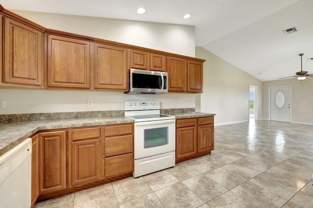 kitchen featuring white appliances, high vaulted ceiling, light tile patterned floors, and ceiling fan