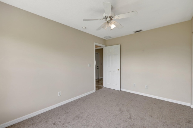 carpeted empty room with ceiling fan