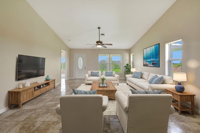 living room with high vaulted ceiling, light tile patterned floors, and ceiling fan