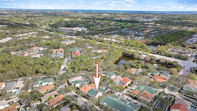 bird's eye view featuring a water view and a residential view