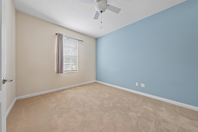 unfurnished room featuring a ceiling fan, carpet, baseboards, and a textured ceiling