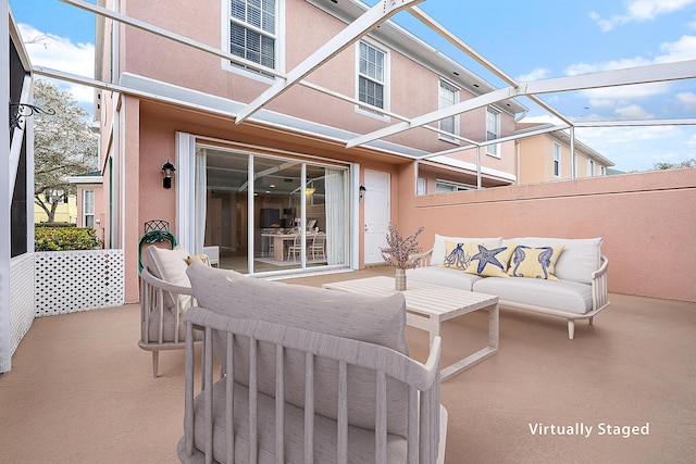 view of patio / terrace featuring glass enclosure and outdoor lounge area