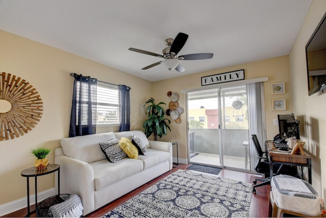 living room featuring hardwood / wood-style flooring, plenty of natural light, and ceiling fan