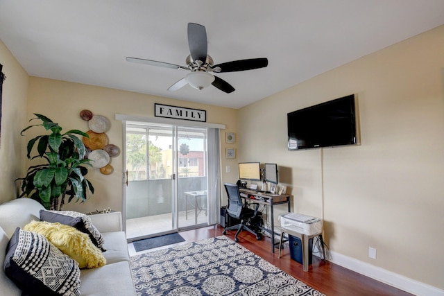 living room with ceiling fan and wood-type flooring