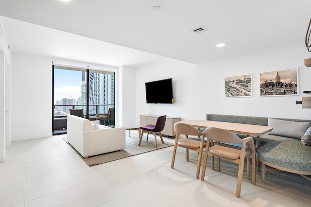 tiled living room featuring breakfast area