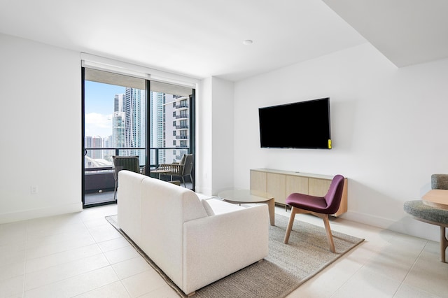 tiled living room featuring expansive windows