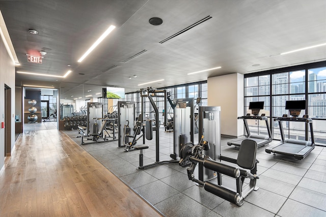 gym with floor to ceiling windows