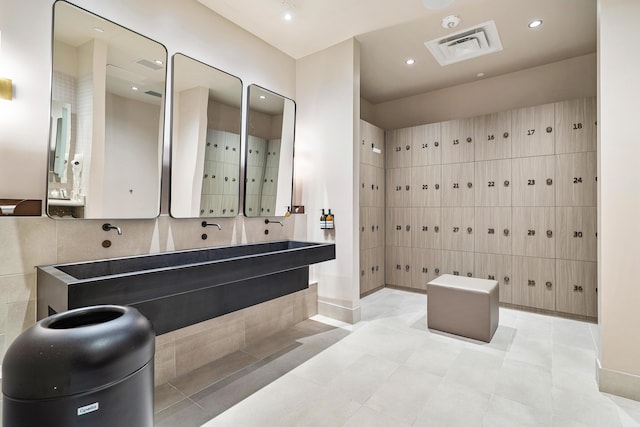 bathroom with vanity and mail boxes