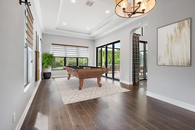 rec room with billiards, a tray ceiling, ornamental molding, and hardwood / wood-style flooring