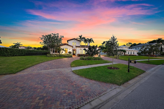 view of front of property with a lawn