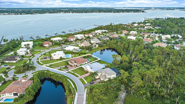 birds eye view of property featuring a water view