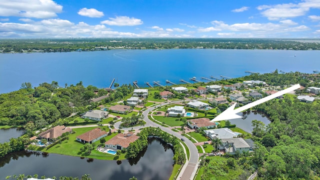 birds eye view of property with a water view