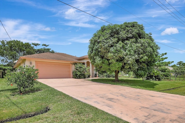 view of front facade with a garage and a front yard