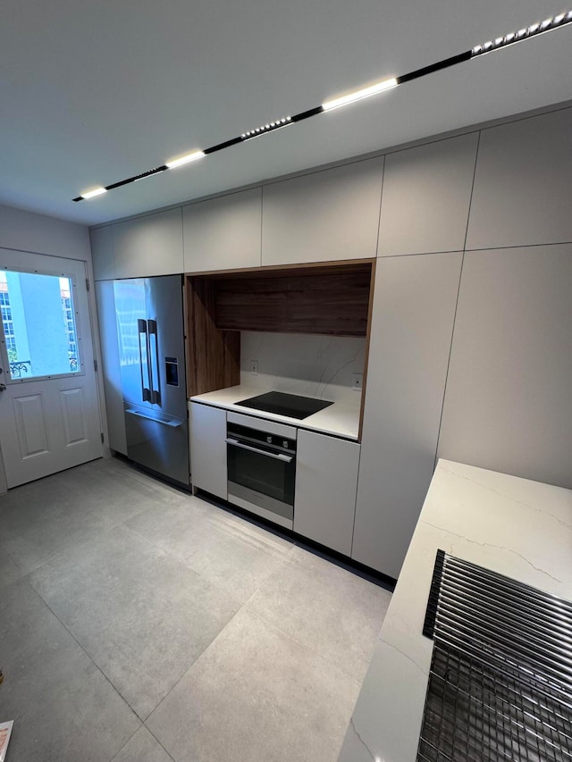 kitchen with stainless steel appliances and white cabinets