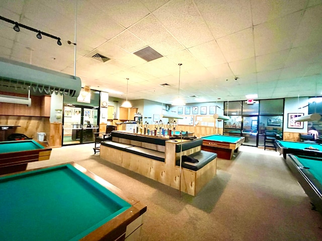 recreation room featuring carpet, wooden walls, and billiards